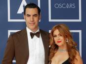 Sacha Baron Cohen and Isla Fisher attend a screening of the 2021 Oscars in Sydney. Rick Rycroft/Pool via REUTERS